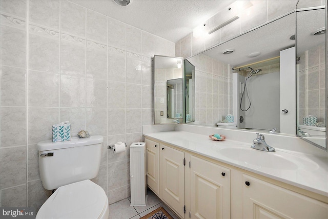 9900 Coastal Hwy Unit 401, Ocean City, MD 21842 - bathroom featuring toilet, tile walls, vanity, and a textured ceiling