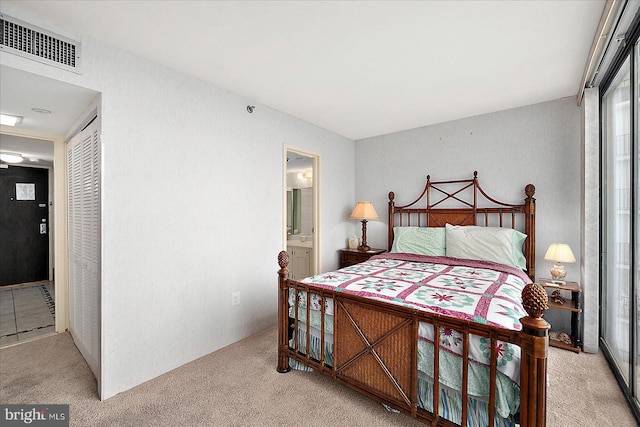 9900 Coastal Hwy Unit 401, Ocean City, MD 21842 - bedroom with light carpet, a closet, and ensuite bathroom