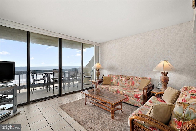 9900 Coastal Hwy Unit 401, Ocean City, MD 21842 - living area with light tile patterned floors, expansive windows, and a water view