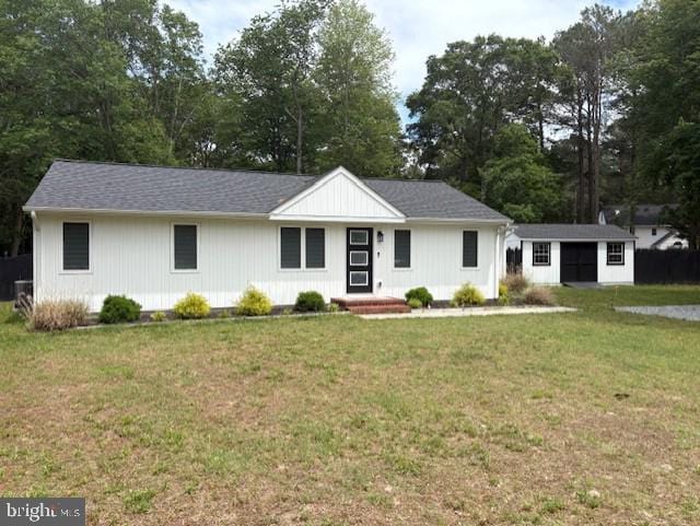 303 Ellendale Cir, Salisbury, MD 21804 - single story home with a front lawn, an outdoor structure, and view of scattered trees