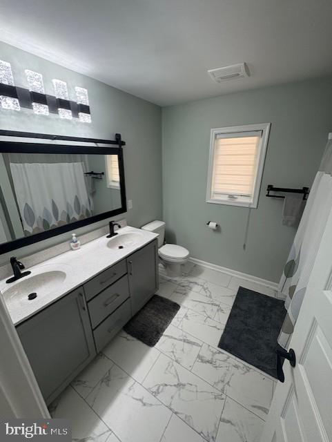 303 Ellendale Cir, Salisbury, MD 21804 - bathroom with marble finish floors, double vanity, and a shower with curtain
