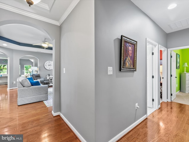 34897 Seagrass Plantation Ln, Dagsboro, DE 19939 - hall featuring arched walkways, wood finished floors, crown molding, a baseboard heating unit, and baseboards