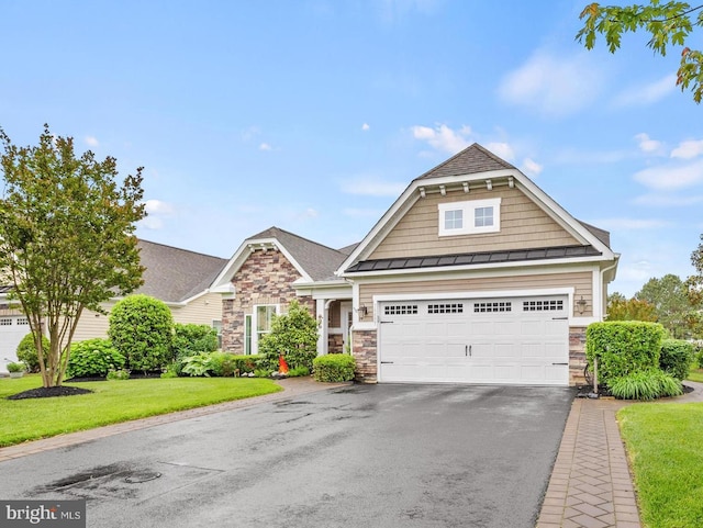 34897 Seagrass Plantation Ln, Dagsboro, DE 19939 - view of front facade with a standing seam roof, driveway, stone siding, and a front yard