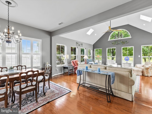 34897 Seagrass Plantation Ln, Dagsboro, DE 19939 - dining area with a chandelier, wood finished floors, a ceiling fan, and high vaulted ceiling