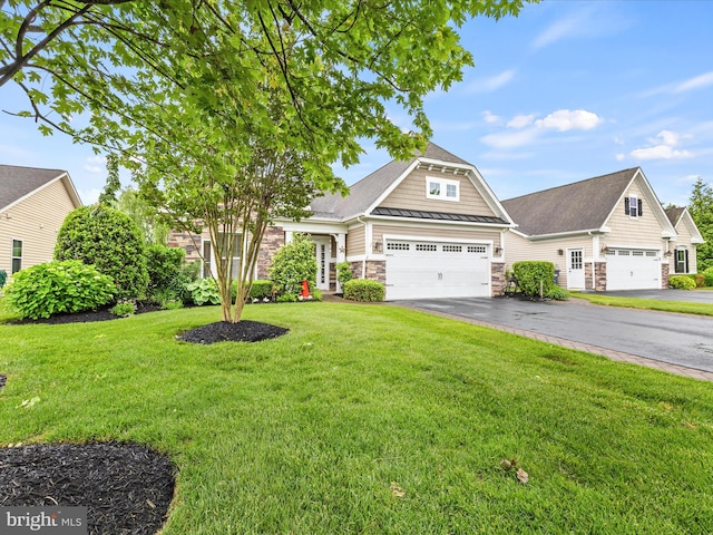 34897 Seagrass Plantation Ln, Dagsboro, DE 19939 - view of front of property featuring stone siding, asphalt driveway, a standing seam roof, a front lawn, and an attached garage