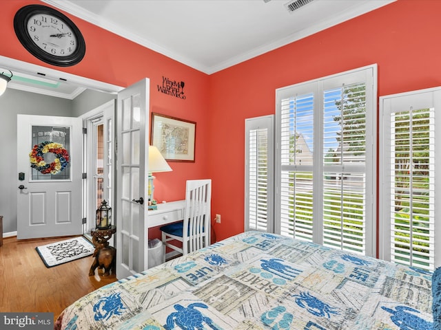 34897 Seagrass Plantation Ln, Dagsboro, DE 19939 - bedroom with crown molding, wood finished floors, and french doors