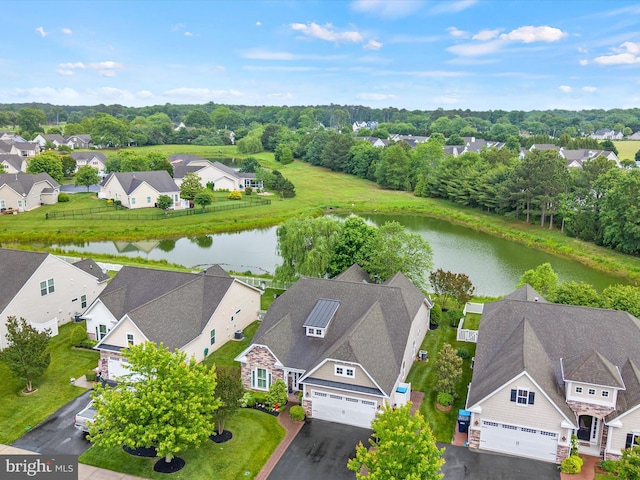 34897 Seagrass Plantation Ln, Dagsboro, DE 19939 - aerial view of residential area with a nearby body of water and a tree filled landscape
