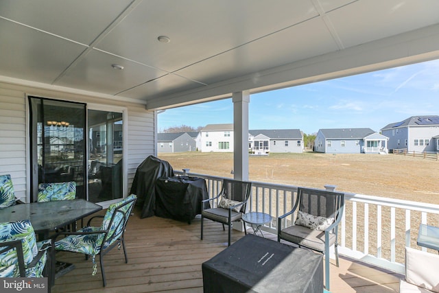 6293 Bobcat Ln, King George, VA 22485 - wooden terrace with a residential view, a grill, and outdoor dining space