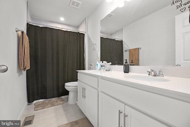 6293 Bobcat Ln, King George, VA 22485 - full bathroom featuring toilet, double vanity, tile patterned flooring, and a shower with shower curtain