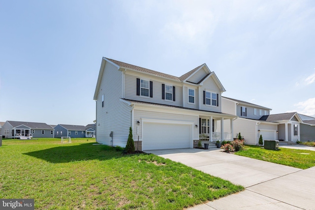6293 Bobcat Ln, King George, VA 22485 - traditional home with driveway, a garage, a front lawn, covered porch, and a residential view