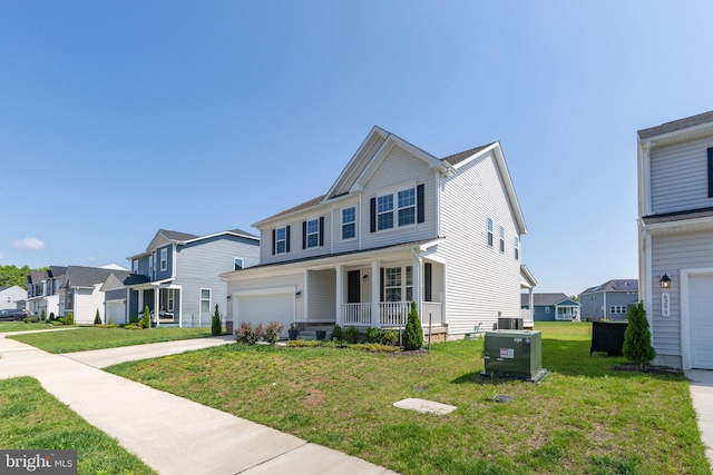 6293 Bobcat Ln, King George, VA 22485 - traditional home featuring covered porch, a residential view, a front lawn, and driveway