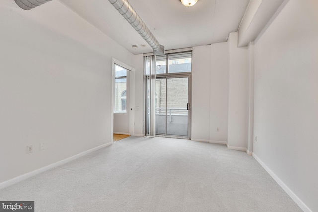 811 4th St NW Unit 320, Washington, DC 20001 - carpeted empty room with baseboards