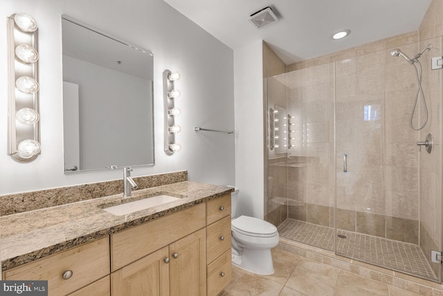 811 4th St NW Unit 320, Washington, DC 20001 - bathroom with vanity, a shower stall, toilet, and tile patterned flooring