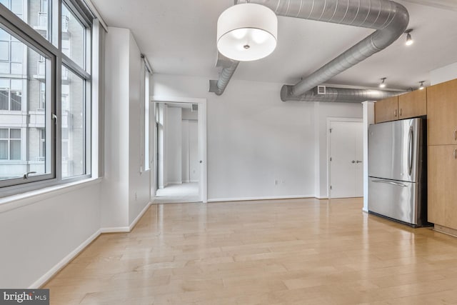 811 4th St NW Unit 320, Washington, DC 20001 - spare room with healthy amount of natural light, light wood finished floors, and baseboards