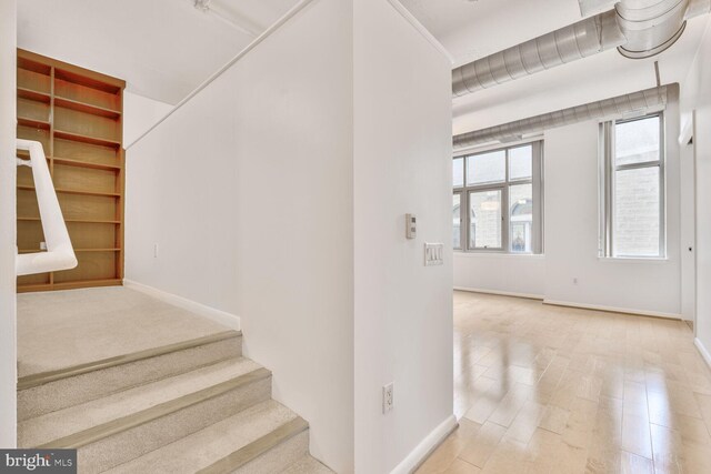 811 4th St NW Unit 320, Washington, DC 20001 - stairway featuring healthy amount of natural light and baseboards