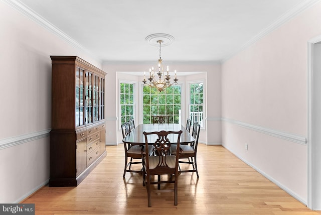 20783 Laplume Pl, Ashburn, VA 20147 - dining area with a chandelier, light wood finished floors, ornamental molding, and baseboards