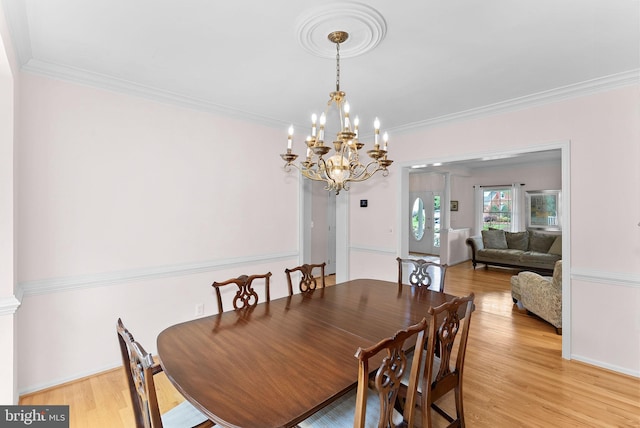 20783 Laplume Pl, Ashburn, VA 20147 - dining area with a chandelier, crown molding, and light wood-type flooring