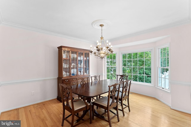 20783 Laplume Pl, Ashburn, VA 20147 - dining room featuring a chandelier, light wood-style floors, baseboards, and ornamental molding
