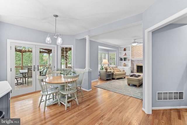 20783 Laplume Pl, Ashburn, VA 20147 - dining area with light wood-style flooring, built in features, a ceiling fan, baseboards, and french doors