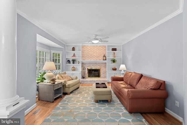 20783 Laplume Pl, Ashburn, VA 20147 - living area featuring wood finished floors, a ceiling fan, ornamental molding, built in shelves, and baseboards