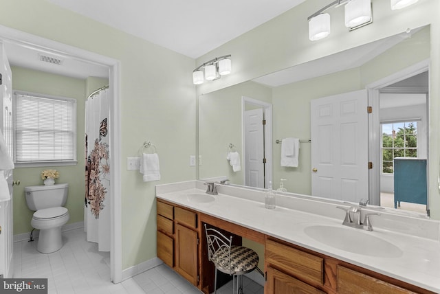 20783 Laplume Pl, Ashburn, VA 20147 - full bathroom with toilet, double vanity, tile patterned flooring, and baseboards