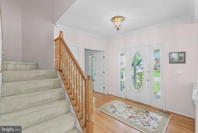 20783 Laplume Pl, Ashburn, VA 20147 - entrance foyer with wood finished floors, stairs, ornamental molding, and baseboards