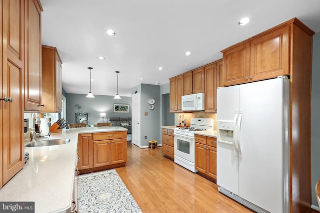 14428 William Carr Ln, Centreville, VA 20120 - kitchen with white appliances, a sink, light countertops, tasteful backsplash, and recessed lighting