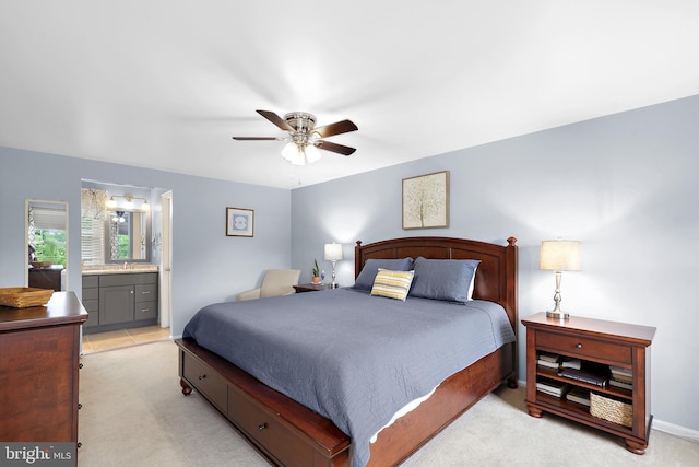 14428 William Carr Ln, Centreville, VA 20120 - bedroom with light carpet, a ceiling fan, ensuite bathroom, and a sink