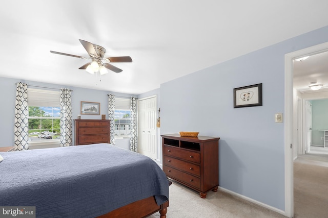 14428 William Carr Ln, Centreville, VA 20120 - bedroom with light colored carpet, a closet, ceiling fan, and baseboards