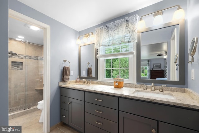 14428 William Carr Ln, Centreville, VA 20120 - full bathroom featuring double vanity, a stall shower, toilet, and tile patterned floors