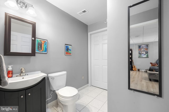 14428 William Carr Ln, Centreville, VA 20120 - half bathroom featuring vanity, baseboards, toilet, and tile patterned floors