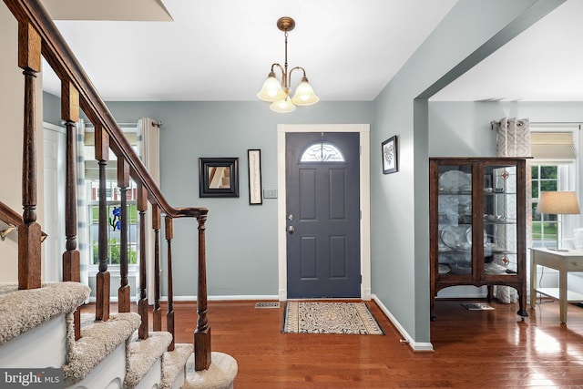 14428 William Carr Ln, Centreville, VA 20120 - foyer entrance featuring stairway, wood finished floors, baseboards, and a chandelier