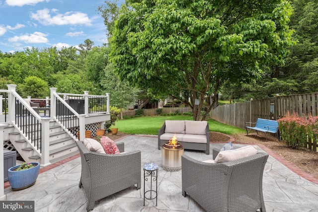 14428 William Carr Ln, Centreville, VA 20120 - view of patio featuring stairs, a wooden deck, and an outdoor living space with a fire pit