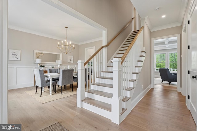 215 S Spring Mill Rd, Villanova, PA 19085 - stairs with wood finished floors, a chandelier, crown molding, and recessed lighting