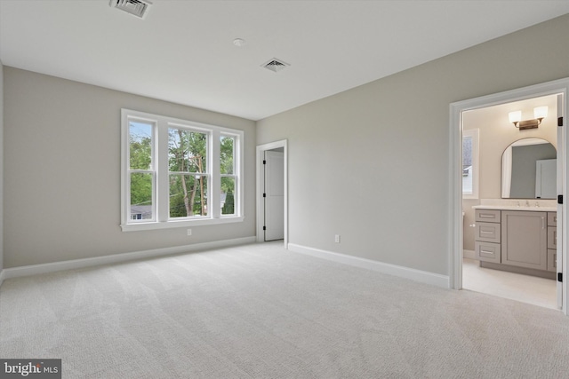 215 S Spring Mill Rd, Villanova, PA 19085 - unfurnished bedroom featuring light colored carpet, baseboards, a sink, and ensuite bathroom