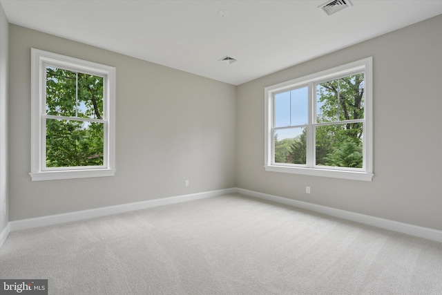 215 S Spring Mill Rd, Villanova, PA 19085 - spare room with baseboards, plenty of natural light, and light colored carpet