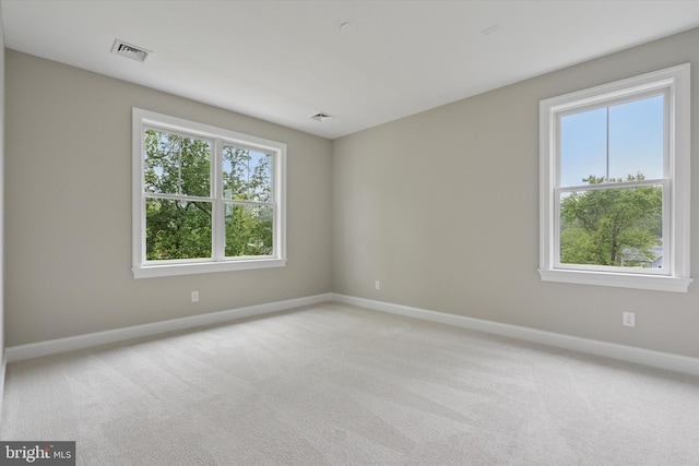 215 S Spring Mill Rd, Villanova, PA 19085 - empty room with plenty of natural light, baseboards, and light colored carpet