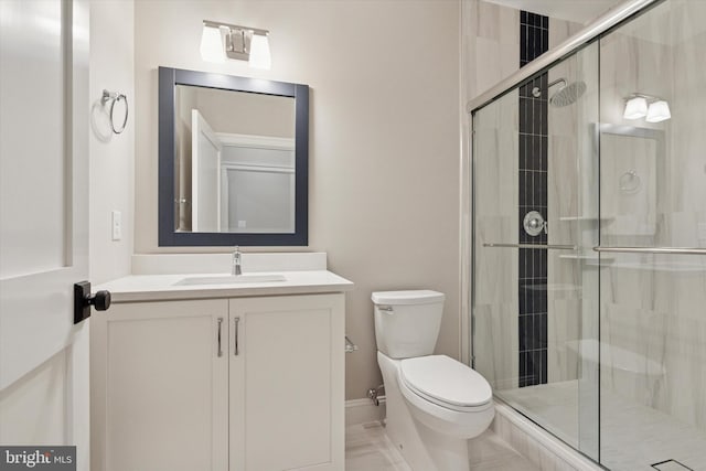 215 S Spring Mill Rd, Villanova, PA 19085 - bathroom featuring toilet, vanity, a stall shower, and baseboards
