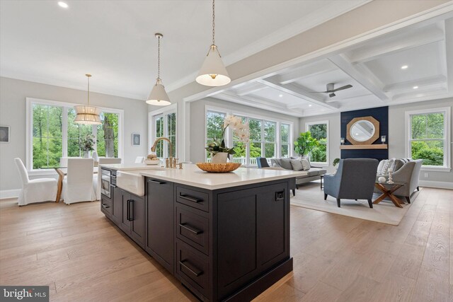 215 S Spring Mill Rd, Villanova, PA 19085 - kitchen featuring a sink, light countertops, recessed lighting, light wood-style floors, and coffered ceiling