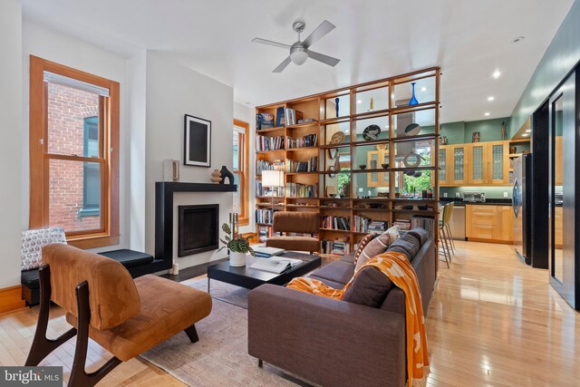135 13th St NE, Washington, DC 20002 - living room featuring light wood finished floors, a fireplace, plenty of natural light, ceiling fan, and recessed lighting