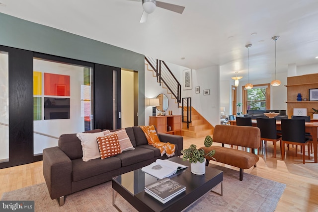 135 13th St NE, Washington, DC 20002 - living area featuring stairs, light wood-type flooring, and a ceiling fan