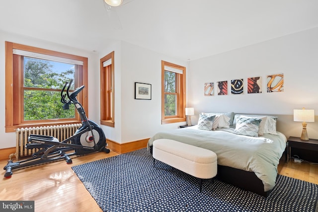 135 13th St NE, Washington, DC 20002 - bedroom with radiator heating unit and wood finished floors