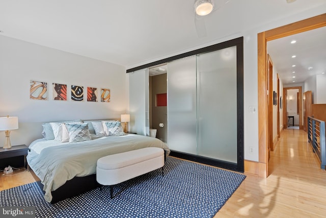 135 13th St NE, Washington, DC 20002 - bedroom with light wood-style floors, recessed lighting, a closet, and baseboards