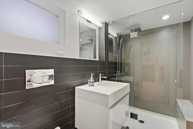 135 13th St NE, Washington, DC 20002 - full bathroom featuring a stall shower, vanity, and tile walls
