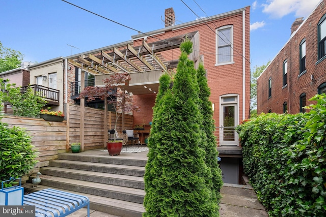 135 13th St NE, Washington, DC 20002 - back of house featuring brick siding and a patio
