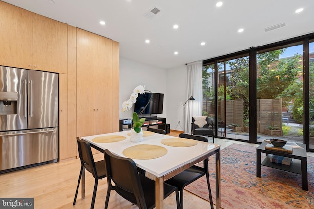 135 13th St NE, Washington, DC 20002 - dining room featuring expansive windows, recessed lighting, and light wood finished floors