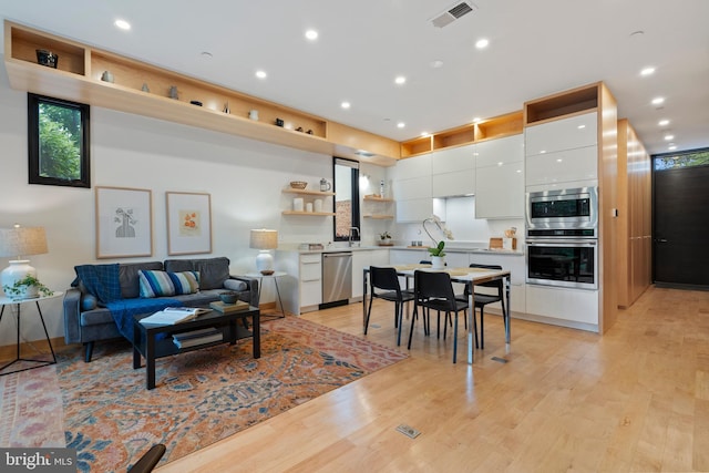 135 13th St NE, Washington, DC 20002 - living area with light wood-style floors and recessed lighting