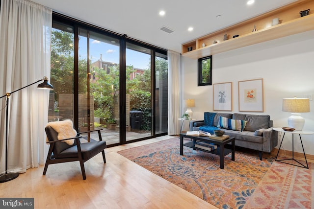 135 13th St NE, Washington, DC 20002 - living room with floor to ceiling windows, wood finished floors, recessed lighting, and baseboards