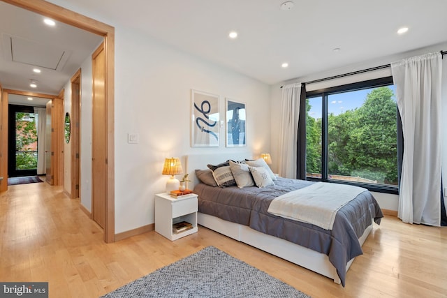 135 13th St NE, Washington, DC 20002 - bedroom with light wood-style flooring, baseboards, recessed lighting, and attic access