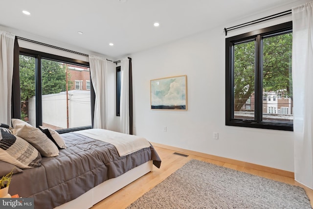 135 13th St NE, Washington, DC 20002 - bedroom with wood finished floors, recessed lighting, and baseboards